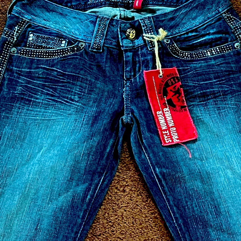 Unique Guess Jeans.  Low rise boot cut NW purchased years ago. Original tags